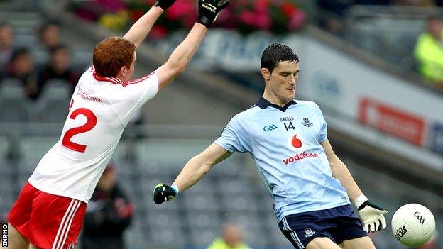 Tyrone's Peter Harte attempts to block a Diarmuid Connolly shot during the 2011 All-Ireland quarter-final