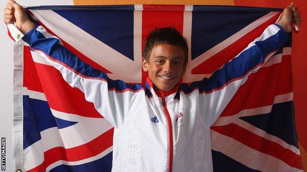 Tom Daley, aged 14, holding a Union Jack flag