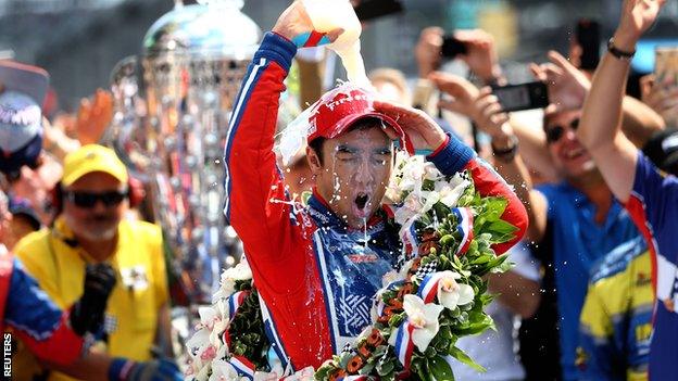 Takuma Sato celebrates