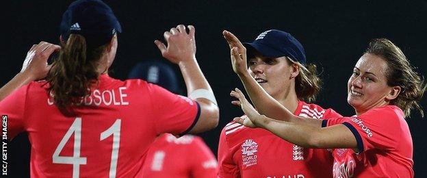 England celebrate a wicket by Laura Marsh (far right)