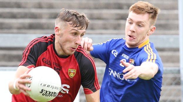 Down's Barry O'Hagan attempts to get away from Longford's Cian Farrelly