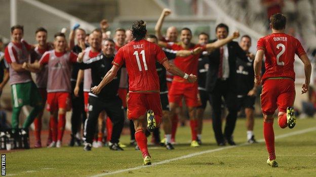 Wales forward Gareth Bale celebrates after scoring the winning goal against Cyprus