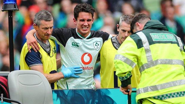 Carbery is helped off during Ireland's win over Italy