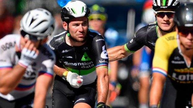 Mark Cavendish (second left) finishes stage four of the Tour