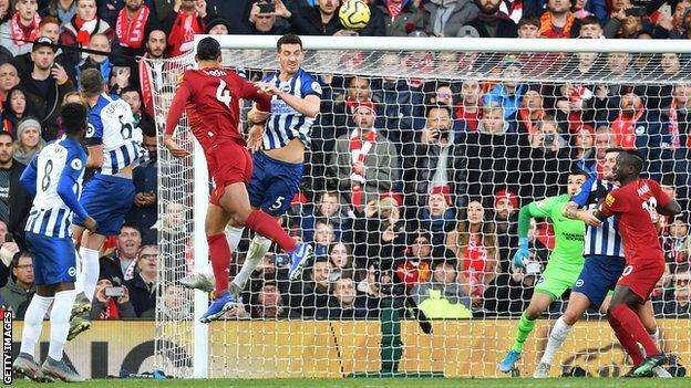 Liverpool's Virgil van Dijk scores against Brighton