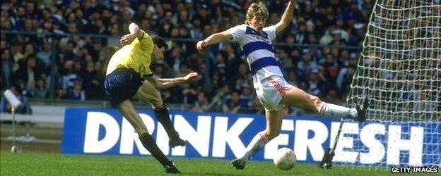 Trevor Hebberd (left) of Oxford scores v QPR in the 1986 League Cup Final