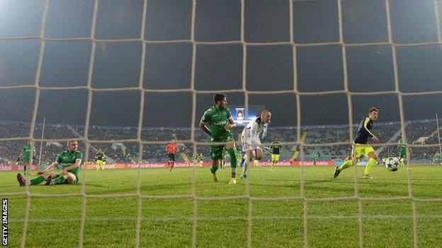 Mesut Ozil (right) scores Arsenal's winner in Bulgaria