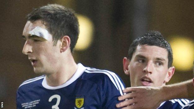 Lee Wallace and Graham Dorrans in action for Scotland