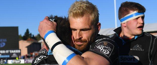 Sean Lamont hugs Glasgow team-mate Henry Pyrgos after his final match before retirement