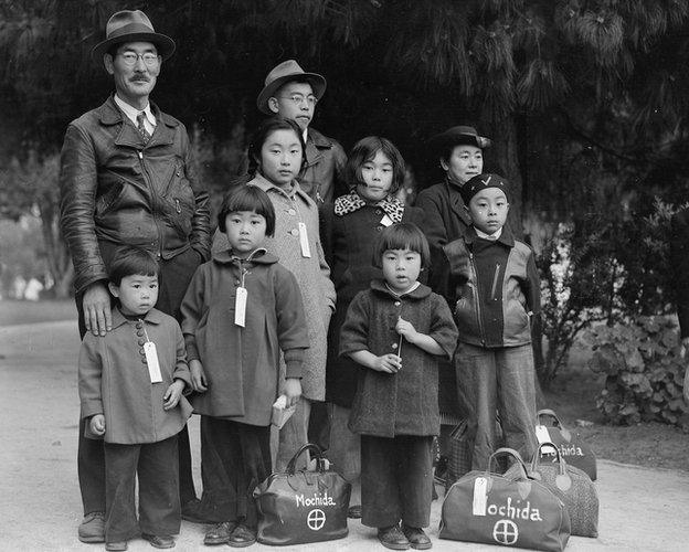 Members of the Mochida family awaiting evacuation bus.