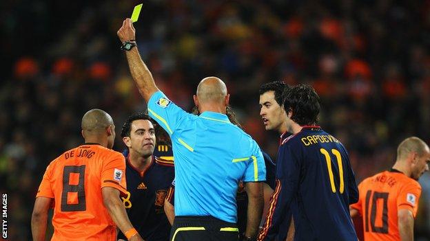 Howard Webb books Nigel de Jong in the World Cup final between Netherlands and Spain in 2010