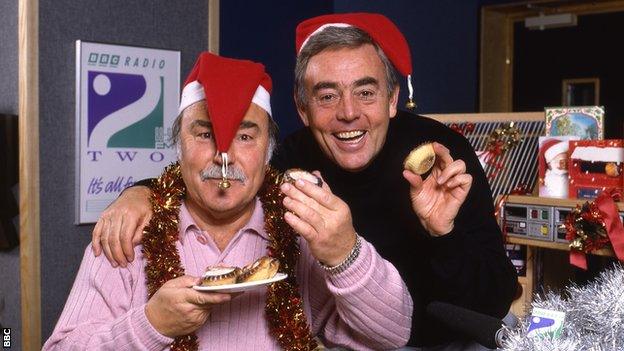 Jimmy Greaves (left) and St John in Christmas hats