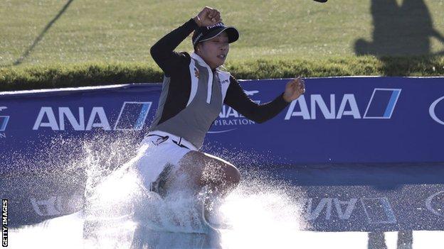 Thailand's Patty Tavatanakit jumps in Poppie's Pond after winning in 2021