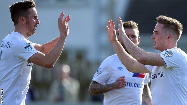 Andrew Waterworth set up Aaron Burns for Linfield's equaliser and the pair celebrate making it 1-1