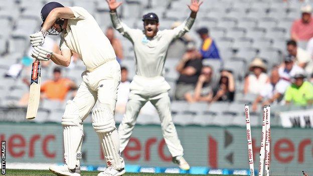 England's Chris Woakes is bowled by Trent Boult