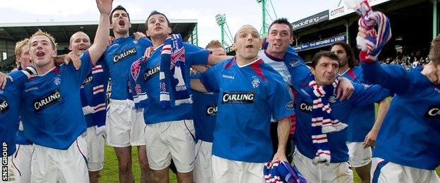 Alex Rae celebrates with his Rangers team-mates as they wait for the trophy to arrive