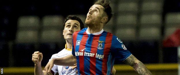 Motherwell's Carl McHugh challenges Caley Thistle's Greg Tansey