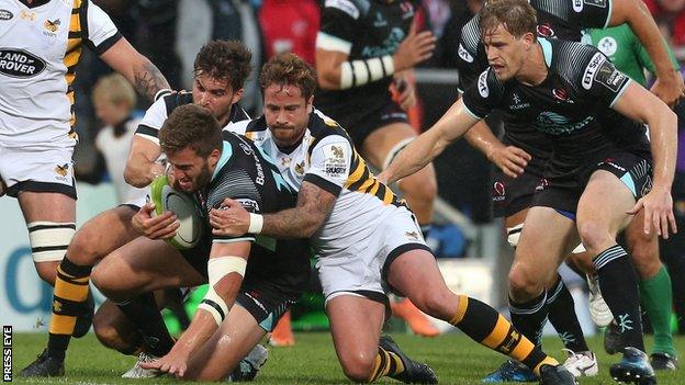 Stuart McCloskey is tackled by Danny Cipriani at Kingspan Stadium