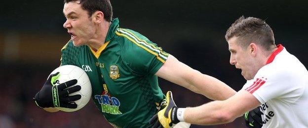 Meath's Harry Rooney is tackled by Tyrone forward Connor McAliskey in the Omagh qualifier