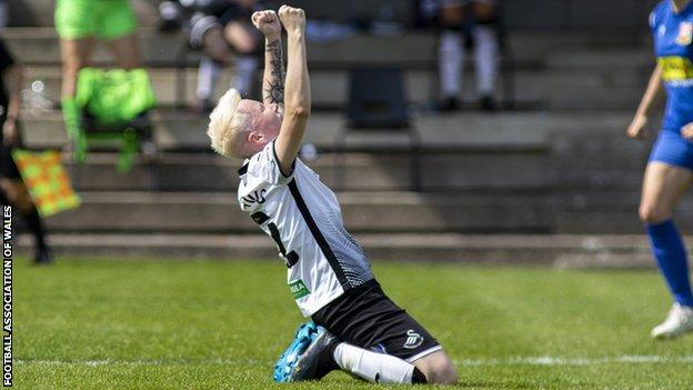 Swansea's Stacey John-Davis celebrates after a draw at Abergavenny in May clinched a league and cup double