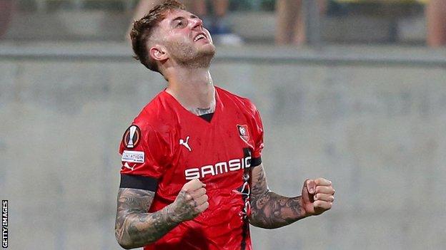 Joe Rodon celebrates Stade Rennais' Europa League triumph over AEK Larnaca earlier this month