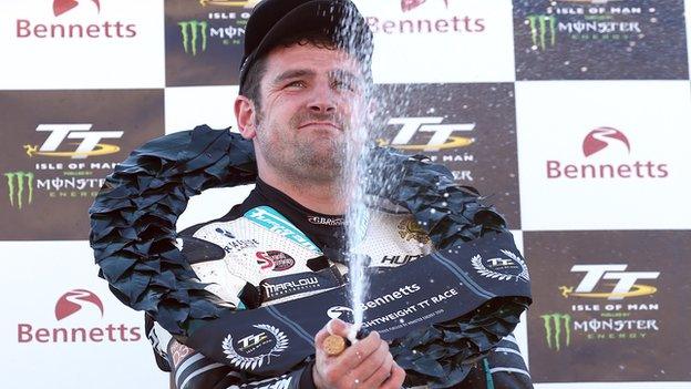 It's time to celebrate for Michael Dunlop after his Supertwins victory in the Isle of Man TT