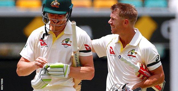 Cameron Bancroft and David Warner celebrate Australia's win in Brisbane