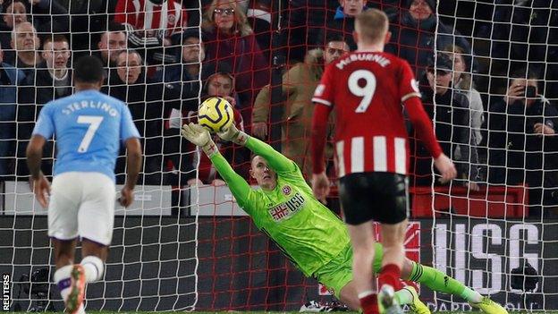 Sheffield United's Dean Henderson saves a penalty from Manchester City's Gabriel Jesus