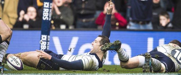 Tim Visser celebrates scoring Scotland's third try