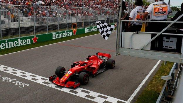 Sebastian Vettel goes past the chequered flag to win the 2018 Canadian Grand Prix