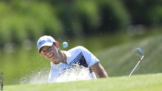 Rory McIlroy hitting a shot out of the bunker at The Players Championship