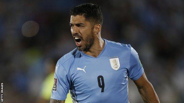 Uruguay striker Luis Suarez celebrates scoring against Venezuela