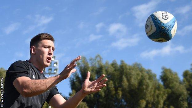 Josh Adams is about to receive the ball at Wales training in Argentina