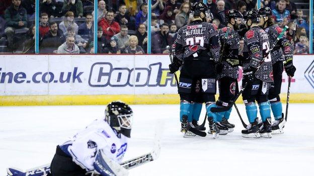 Lightning netminder Adam Goss can only look on as the Giants celebrate after a Blair Riley goal