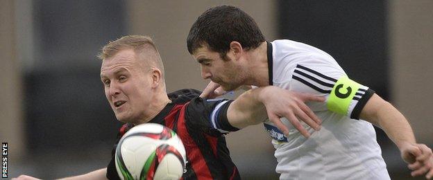 Crusaders striker Jordan Owens in action against Rathfriland's Conor Larkin