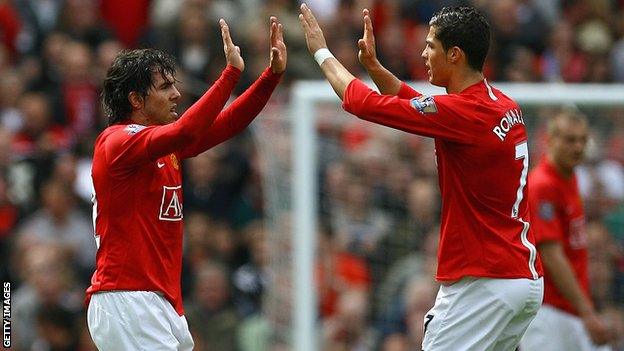 Cristiano Ronaldo and Carlos Tevez celebrate a goal at Old Trafford