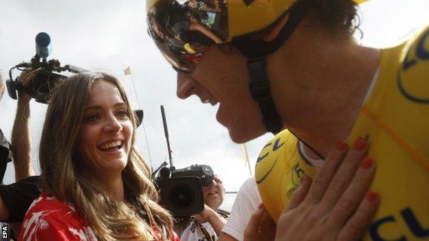 Geraint Thomas being congratulated by his wife Sara after stage 20