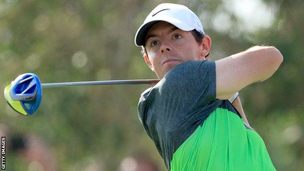 Rory McIlroy hits his tee shot at the ninth on Saturday