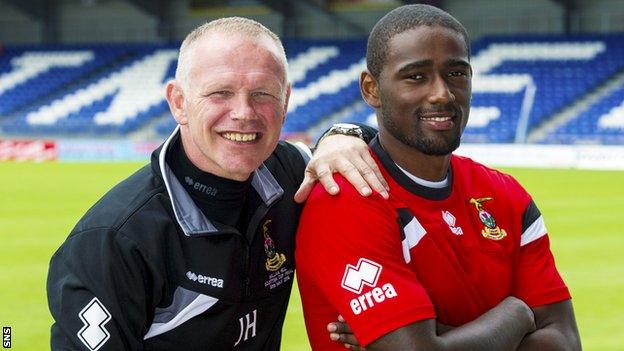 John Hughes with Inverness signing Nathaniel Wedderburn