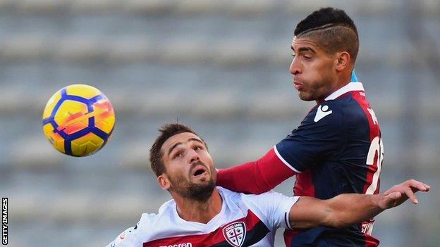 Adam Masina wins a header