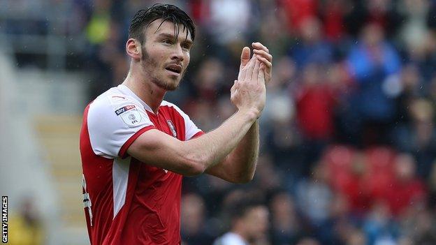 Kieffer Moore applauds the Rotherham fans as he is substituted against Northampton