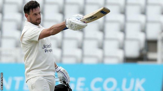 Steven Mullaney celebrates reaching his century for Nottinghamshire against Essex