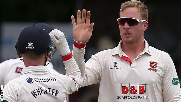 Simon Harmer celebrates a wicket for Essex with Adam Wheater