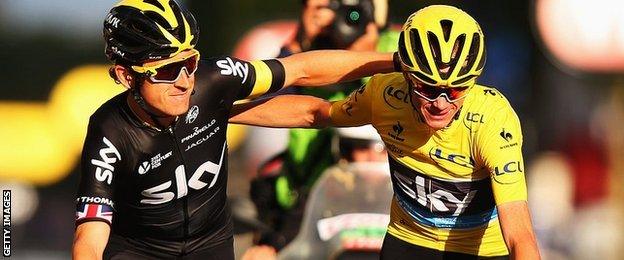 Geraint Thomas crosses the Tour de France finish line with winner and Team Sky leader Chris Froome