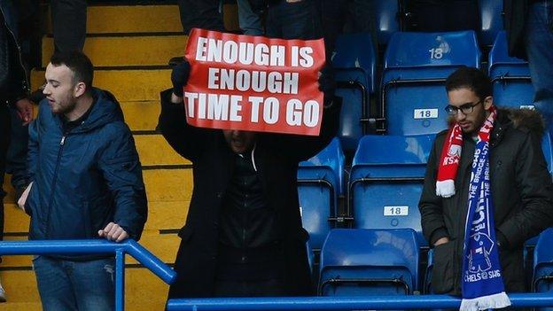 An Arsenal fan makes his point at Stamford Bridge