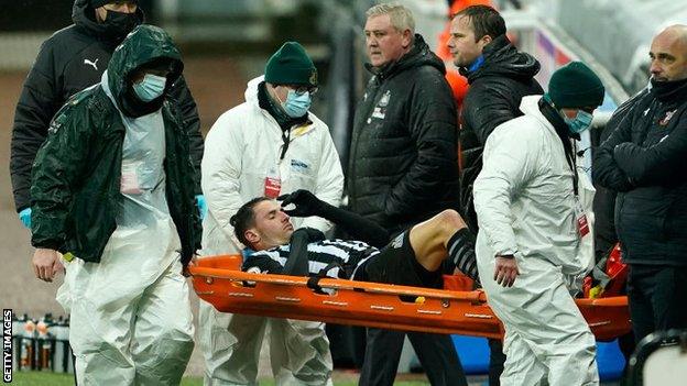 Fabian Schar is carried off the pitch following a knee injury