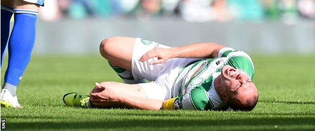 Scott Brown writhes in pain at Celtic Park