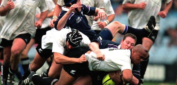 Jonah Lomu takes the ball forward during New Zealand's 69-20 win over Scotland at Carisbrook Park, Dunedin, in 2000