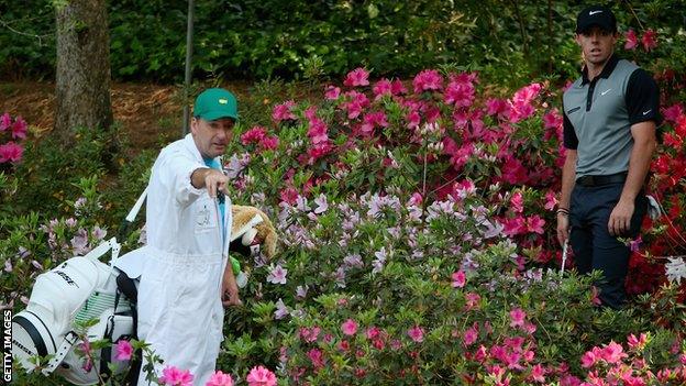 Rory McIlroy tries to plot a route out of Augusta's famous azaleas in 2014