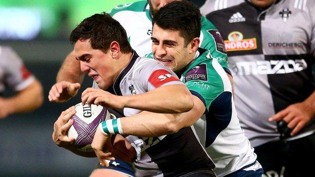 Connacht's Tiernan O'Halloran tackles Brive's Matthieu Ugalde